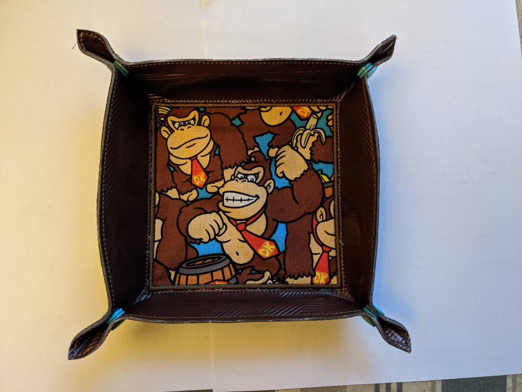 Dice tray shown in brown vinyl with donkey kong fabric.
